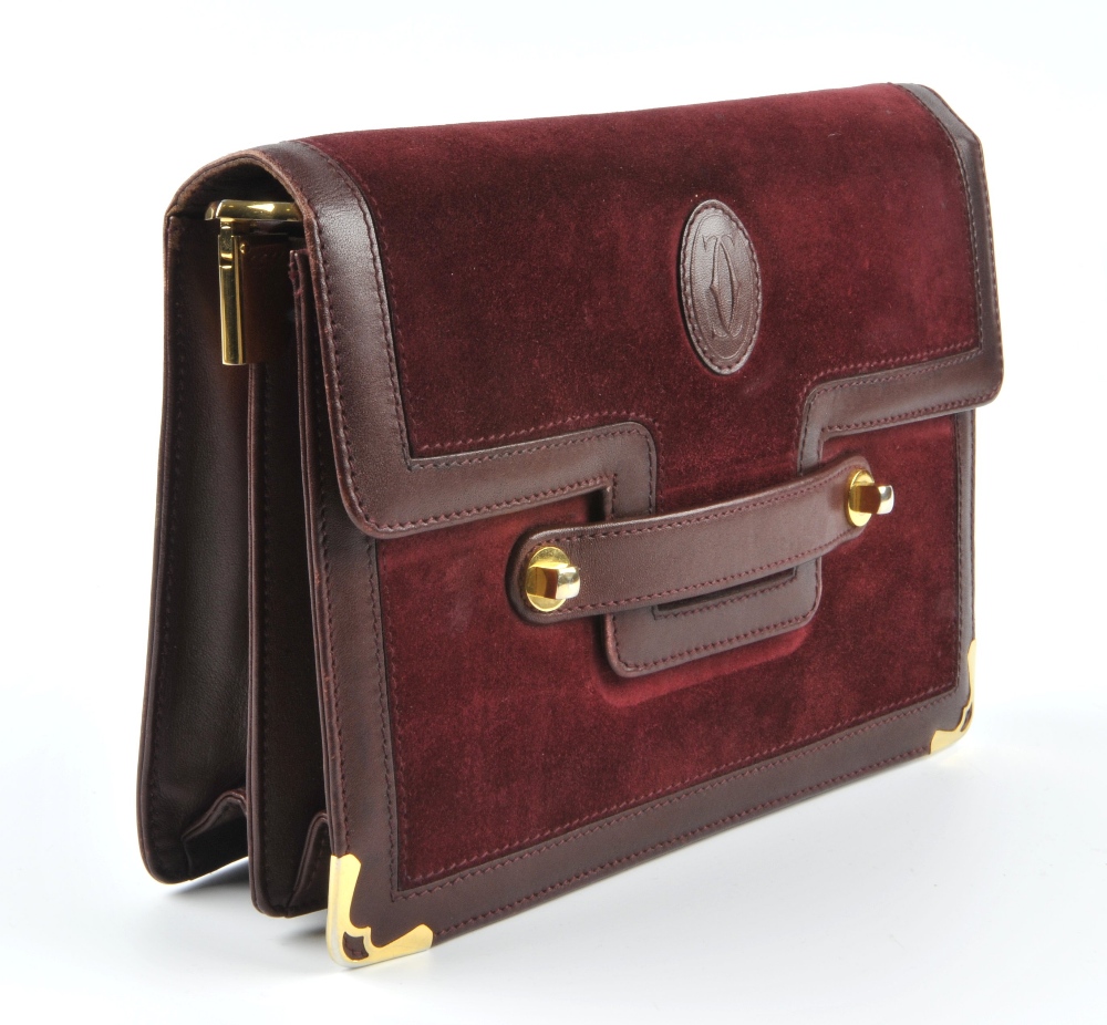 CARTIER - a Bordeaux suede and leather handbag. Designed with a burgundy suede exterior with - Image 3 of 5