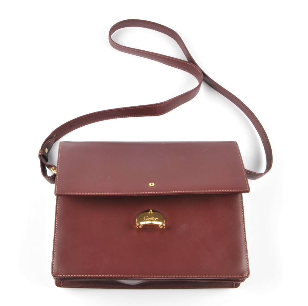 CARTIER - a Bordeaux leather satchel. Crafted from maker's classic burgundy leather, featuring - Image 5 of 5