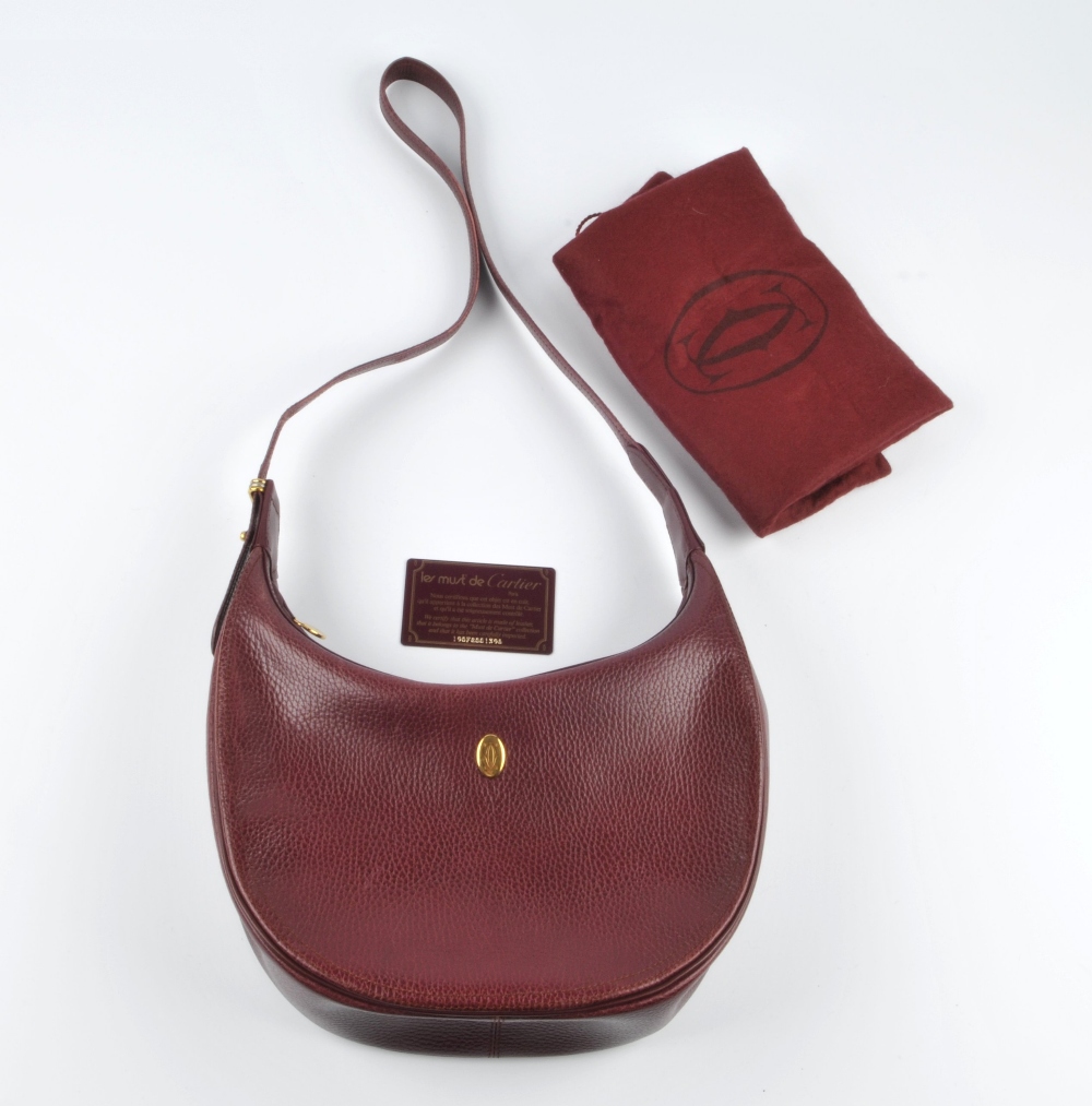 CARTIER - a Bordeaux leather hobo handbag. Featuring a burgundy textured leather exterior with a - Image 3 of 5
