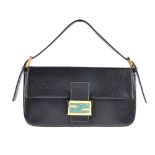 FENDI - a baguette handbag. Featuring a black pebbled leather exterior with contrasting white