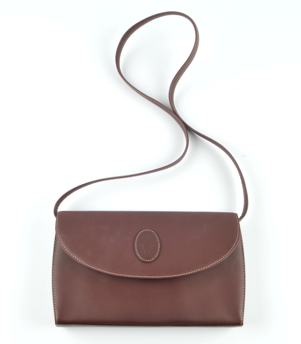 CARTIER - a Bordeaux leather handbag. Designed with maker's classic burgundy leather exterior and - Image 4 of 5