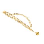 CHANEL - a chain belt. The gold-tone curb-link chain, designed with a looping second chain to the