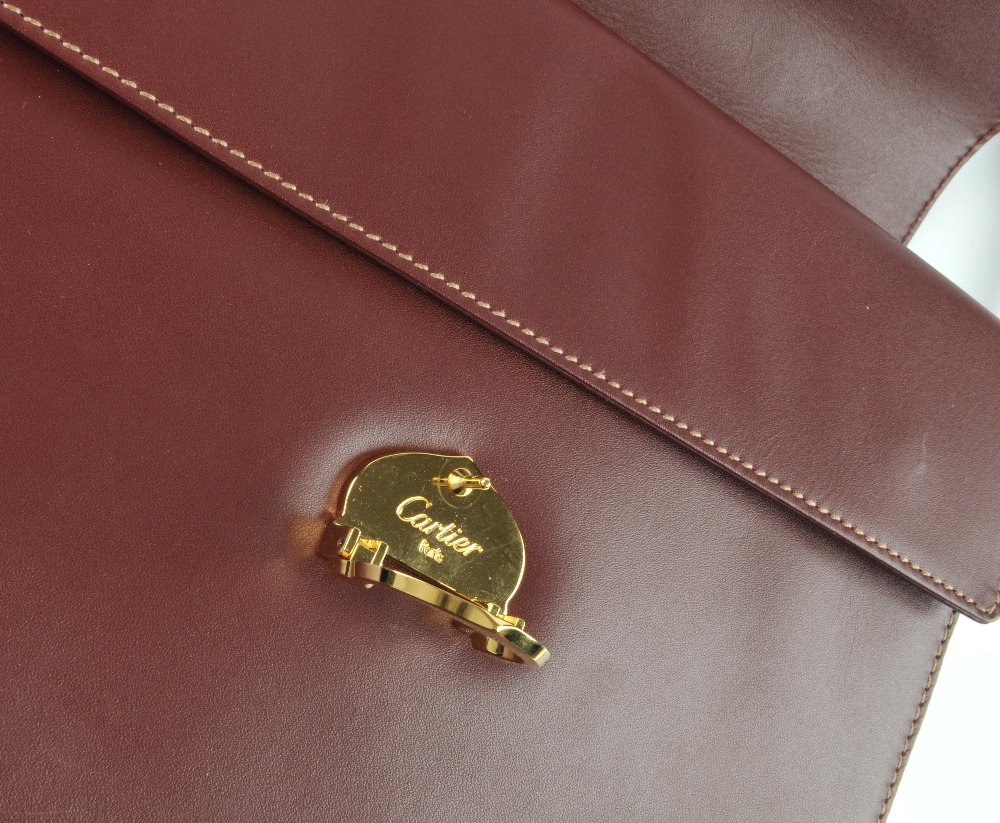 CARTIER - a Bordeaux leather satchel. Crafted from maker's classic burgundy leather, featuring - Image 4 of 5