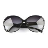 CHANEL - a pair of sunglasses. Designed with black acetate frames, the arms with dark wood