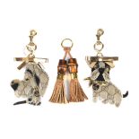 GUCCI - three keychain handbag charms. To include two Guccioli dog charms, crafted from maker's GG