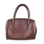 CARTIER - a Bordeaux Boston handbag. Featuring double thin looping handles, top zip fastening,