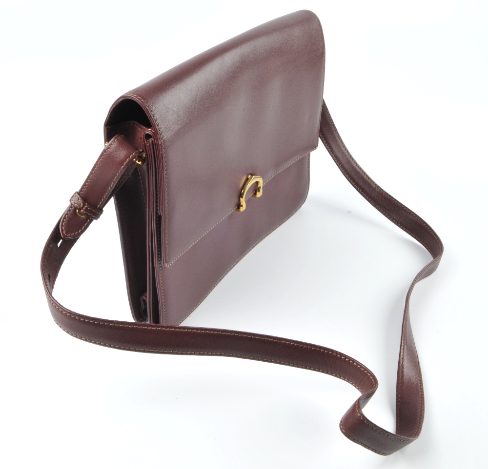 CARTIER - a Bordeaux leather handbag. Featuring maker's signature burgundy leather exterior, - Image 4 of 7