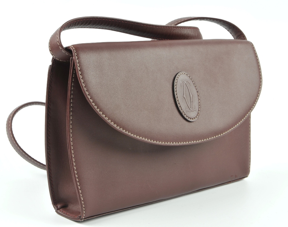 CARTIER - a Bordeaux leather handbag. Designed with maker's classic burgundy leather exterior and - Image 3 of 5