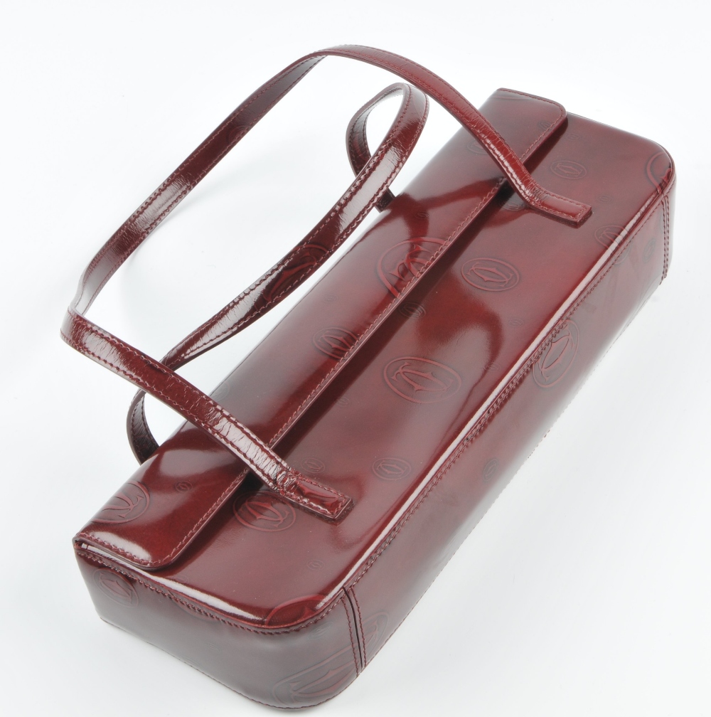 CARTIER - a Happy Birthday long baguette bag. Crafted from burgundy patent leather embossed with - Image 3 of 4