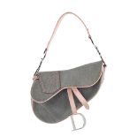 CHRISTIAN DIOR - a grey denim saddle handbag. Featuring a grey denim canvas exterior with smooth