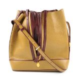 CARTIER - a two-tone bucket tote handbag. Designed with a pebbled mustard leather exterior and