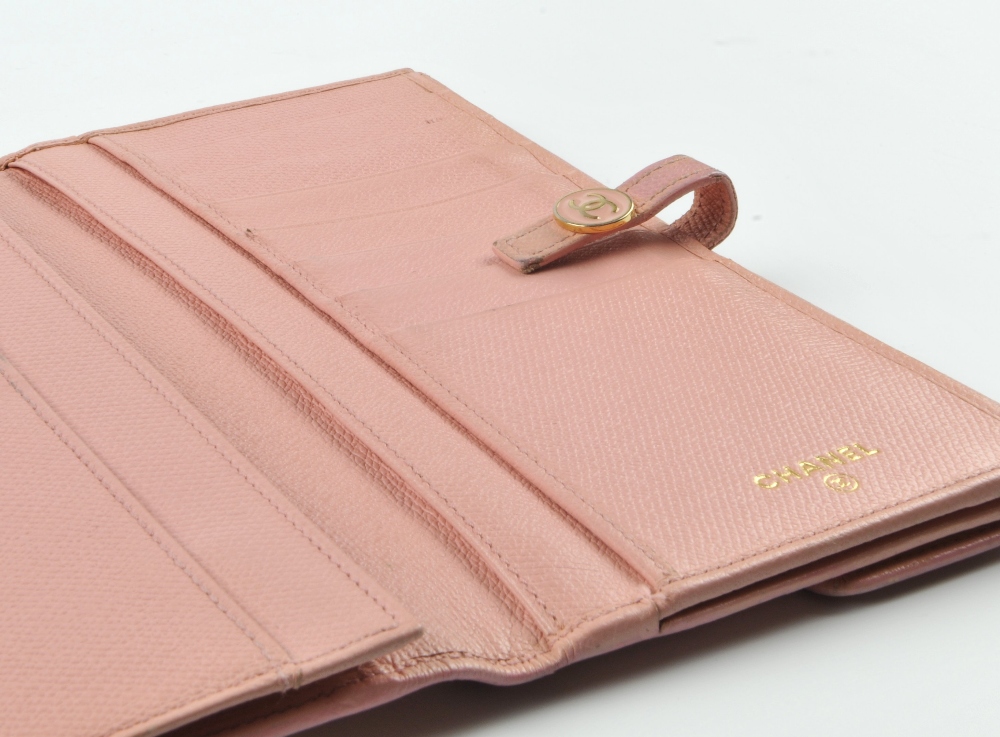 CHANEL - a pink leather wallet. The bifold wallet with press-stud fastening and pink enamel button - Image 4 of 5