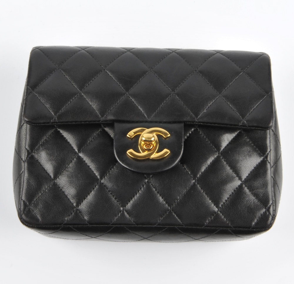 CHANEL - a Mini Classic Flap handbag. Featuring maker's signature black quilted lambskin leather - Image 2 of 7