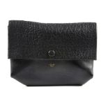 CELINE - a black All Soft leather clutch. Designed with a smooth leather exterior and a