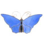 DAVID ANDERSEN - an enamel butterfly brooch. The wings with fanned design in blue enamel, to the