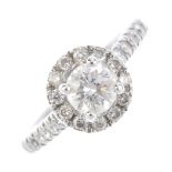 A diamond cluster ring. The brilliant-cut diamond, with similarly-cut diamond surround, gallery