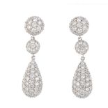 A pair of 18ct gold diamond earrings. Each designed as a pave-set diamond pear-shape panel,