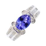 An 18ct gold tanzanite and diamond ring. The oval-shape tanzanite, with single-cut diamond curved