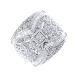 A diamond dress ring. The square-shape diamond quatrefoil, within a brilliant-cut diamond pierced