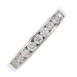 A platinum diamond half-circle eternity ring. The brilliant-cut diamond line, within a channel