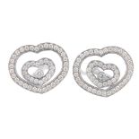 CHOPARD - a pair of 'Happy Spirit' diamond earrings. Each designed as a free-moving brilliant-cut