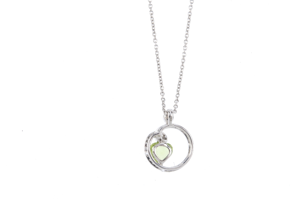 A peridot and diamond pendant. The heart-shape peridot, offset to the brilliant-cut diamond openwork - Image 2 of 3