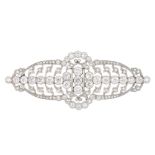 A mid 20th century diamond brooch. Of openwork design, the circular-cut diamond cluster, with vari-