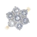 An 18ct gold diamond floral cluster ring. The brilliant-cut diamond cluster, to the tapered band.