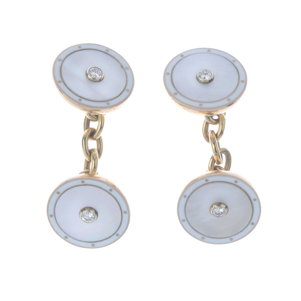 A pair of 9ct gold diamond and gem-set cufflinks. Each designed as a mother-of-pearl disc with