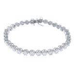 A diamond bracelet. Designed as a series of brilliant-cut diamond cluster links, to the push