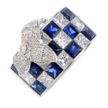 A sapphire and diamond dress ring. Designed as a square-shape sapphire and diamond chequerboard