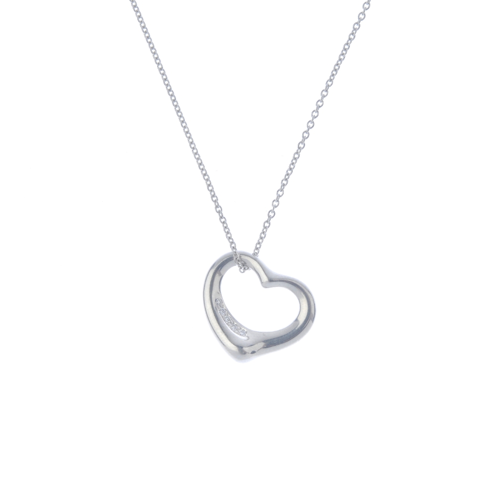 TIFFANY & CO. - a diamond 'Open Heart' pendant. The stylised heart, with graduated brilliant-cut