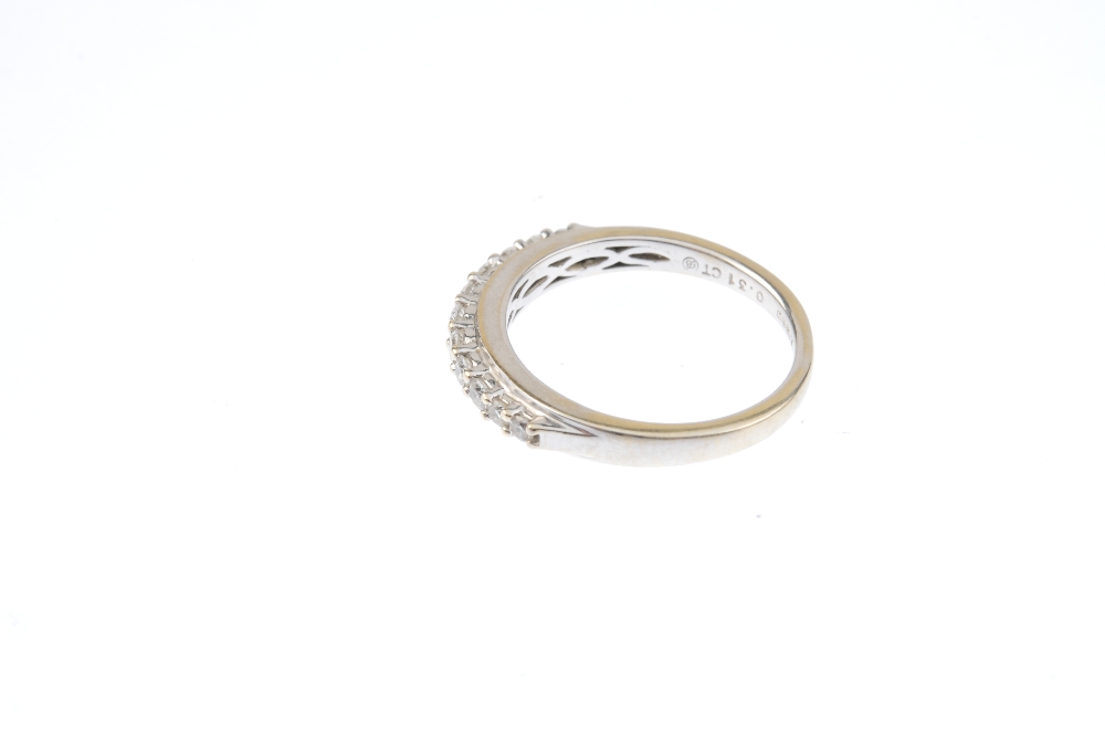 An 18ct gold diamond half-circle eternity ring. The graduated brilliant-cut diamond line, with - Image 2 of 3