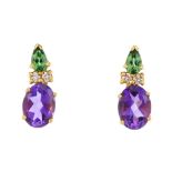 A pair of 18ct gold amethyst, tourmaline and diamond earrings. Each designed as an oval-shape