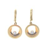 CHOPARD - a pair of 18ct gold 'Happy Diamonds' earrings. Each designed as a free-moving brilliant-