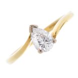 An 18ct gold diamond single-stone ring. The pear-shape diamond, with asymmetric shoulders and