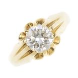 A gentleman's 18ct gold diamond single-stone ring. The brilliant-cut diamond, with grooved and