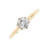 An 18ct gold diamond single-stone ring. The brilliant-cut diamond, with tapered shoulders and