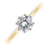 An 18ct gold diamond single-stone ring. The brilliant-cut diamond, with tapered shoulders and