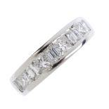 A platinum diamond half-circle eternity ring. Designed as an alternating square and rectangular-