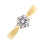 An 18ct gold diamond single-stone ring. The brilliant-cut diamond, with tapered shoulders. Diamond