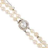 A cultured pearl two-row necklace. Comprising two slightly graduated strands of fifty-seven and