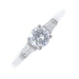 An 18ct gold diamond ring. The brilliant-cut diamond, with tapered baguette-cut diamond sides and