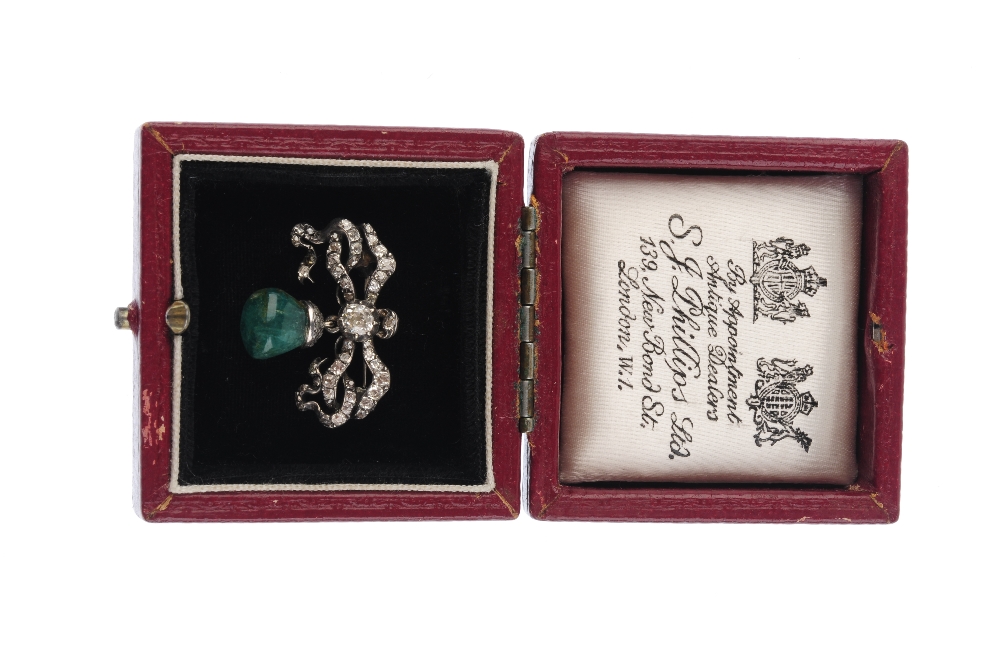 A mid Victorian silver diamond and emerald brooch. Designed as an old-cut diamond scrolling bow, - Image 3 of 3