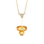 An 18ct gold citrine and diamond necklace. The brilliant-cut diamond and oval-shape citrine floral