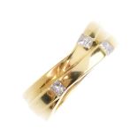 BOODLES - an 18ct gold diamond dress ring. Comprising a series of three crossover bands, each with