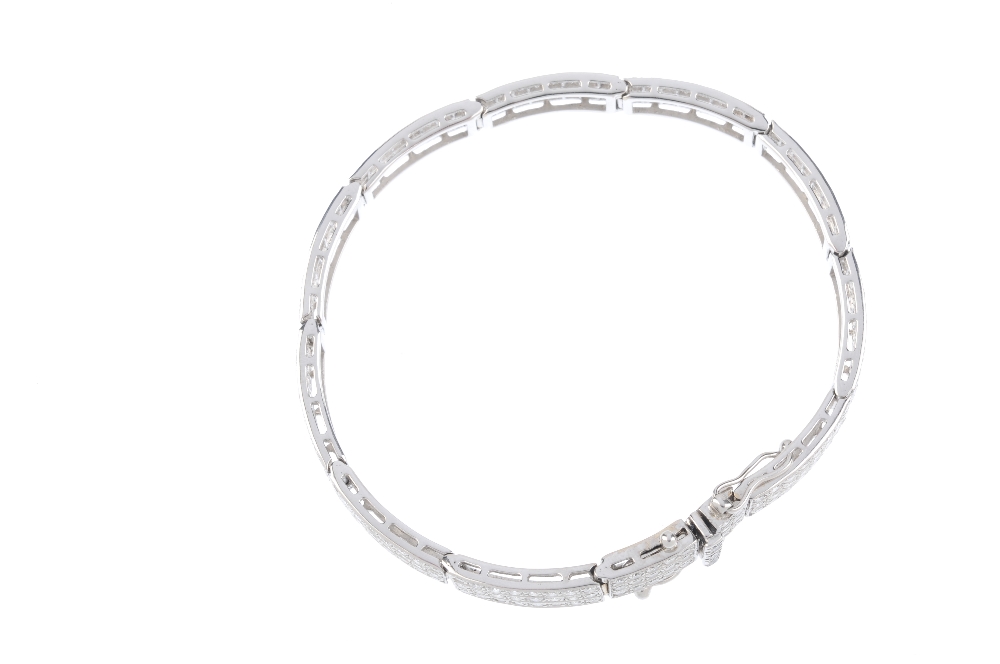 A diamond bracelet. Designed as three brilliant-cut diamond lines, with polished bar spacers and - Image 3 of 3