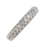 A diamond band ring. The pave-set brilliant-cut diamond panel, to the plain band. Estimated total