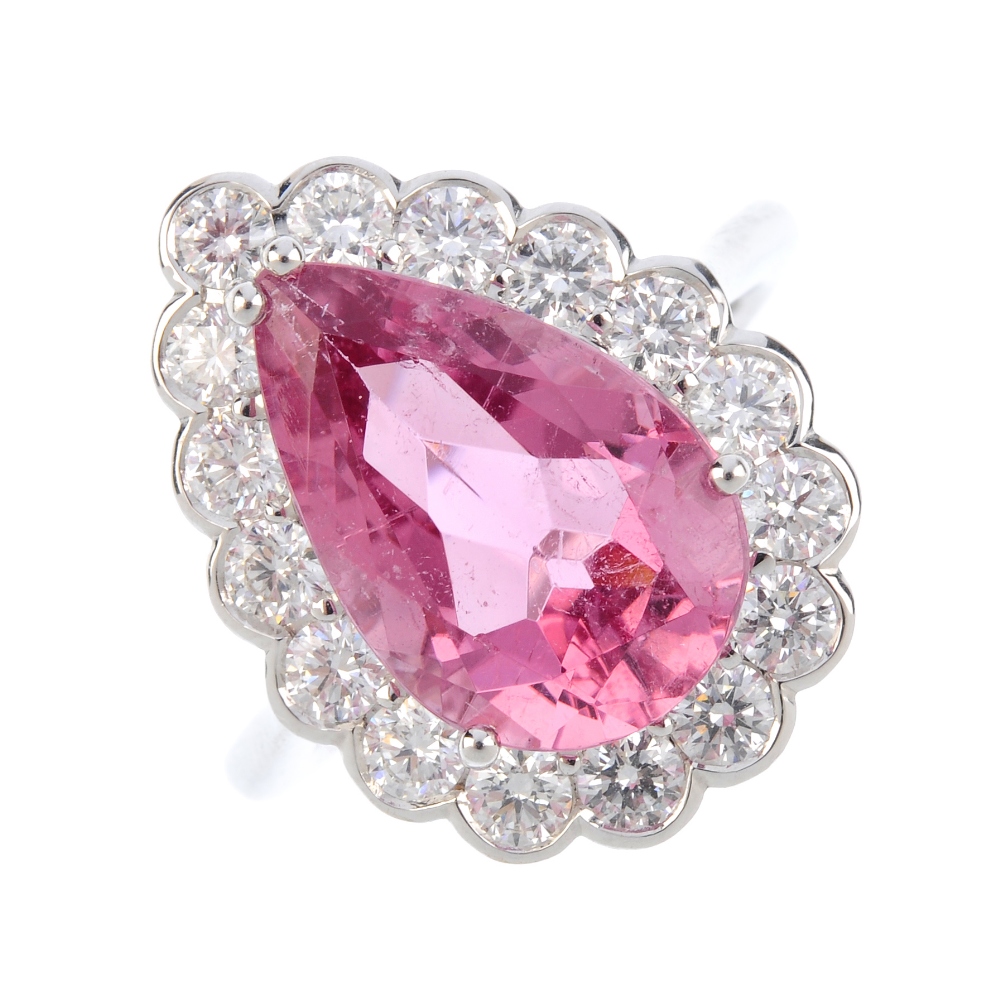 A tourmaline and diamond cluster ring. The pear-shape pink tourmaline, within a brilliant-cut