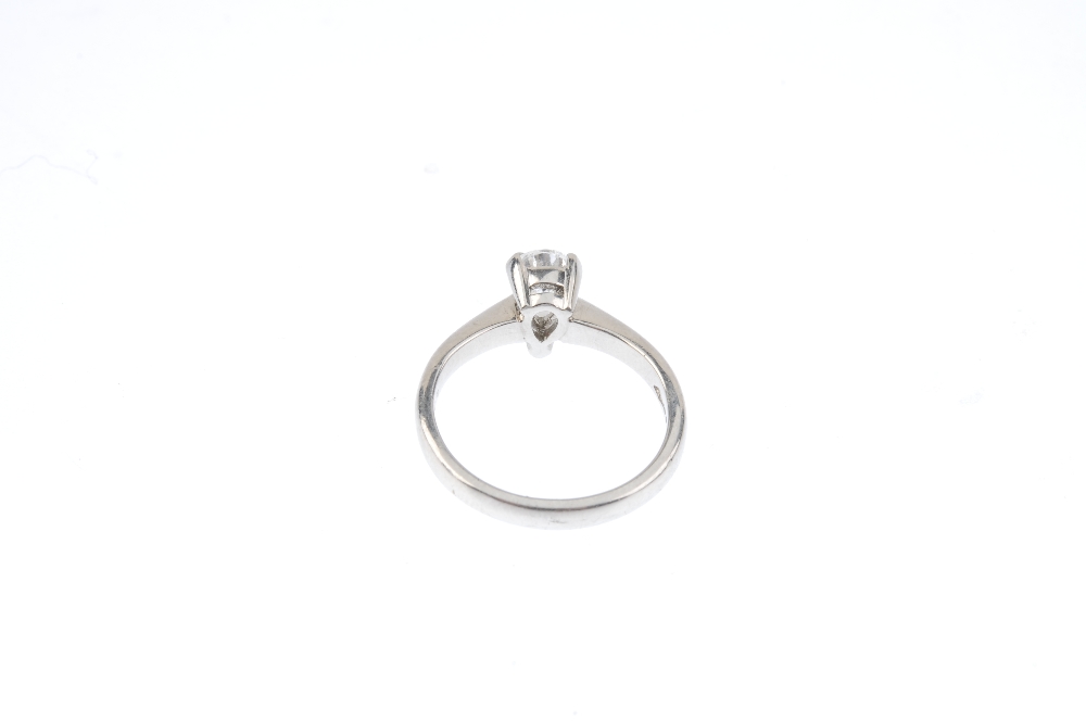 A platinum diamond single-stone ring. The pear-shape diamond, with tapered shoulders and plain band. - Image 3 of 3